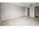 Large main bedroom features tile floors, neutral paint, and ensuite bath at 843 Greenfield Dr, Palm Harbor, FL 34684