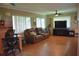 Comfortable living area with a desk and television at 9639 Mainlands E Blvd, Pinellas Park, FL 33782