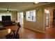 Open-concept living space with views into the kitchen, featuring wood floors and a seamless flow for entertaining at 9639 Mainlands E Blvd, Pinellas Park, FL 33782