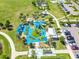 This aerial view highlights the community playground, green space, and convenient parking area at 4222 Hartwood Ln # 1202, Tampa, FL 33618