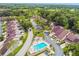 Beautiful aerial view of the community, highlighting the lush landscaping and neighborhood pool at 4222 Hartwood Ln # 1202, Tampa, FL 33618