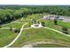 Aerial view of a lush park with winding walking paths and manicured landscaping at 4222 Hartwood Ln # 1202, Tampa, FL 33618