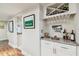 Chic bar area with granite countertops, wine rack, and stylish decor, perfect for entertaining guests at 4222 Hartwood Ln # 1202, Tampa, FL 33618