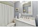 Bathroom featuring a modern vanity with a white countertop, complemented by a shower with a white curtain at 4222 Hartwood Ln # 1202, Tampa, FL 33618