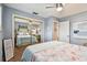 Bright bedroom features flamingo-themed bedding, ceiling fan, and mirrored closet doors at 4222 Hartwood Ln # 1202, Tampa, FL 33618