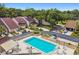 Inviting community pool area with lounge chairs, tables, and meticulously kept landscaping at 4222 Hartwood Ln # 1202, Tampa, FL 33618