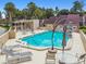 Sparkling community pool area with multiple lounge chairs and tables, perfect for relaxation and socializing at 4222 Hartwood Ln # 1202, Tampa, FL 33618