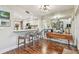 Light-filled dining area with stylish bar seating, and serene backyard views through French doors at 4222 Hartwood Ln # 1202, Tampa, FL 33618