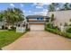Beautiful two-story home with lush landscaping, a spacious driveway, and an attached two car garage at 4222 Hartwood Ln # 1202, Tampa, FL 33618