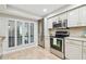 Modern kitchen with stainless appliances, bright lighting and ample counter space, perfect for culinary enthusiasts at 4222 Hartwood Ln # 1202, Tampa, FL 33618