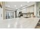 Bright kitchen with stainless appliances, light cabinets, stone countertops, and lots of counter space at 4222 Hartwood Ln # 1202, Tampa, FL 33618