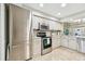 Well-equipped kitchen with stainless steel appliances, ample cabinetry, and natural light for culinary delight at 4222 Hartwood Ln # 1202, Tampa, FL 33618