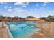 Beautiful lap pool with lane markers and surrounding patio at the community clubhouse at 4222 Hartwood Ln # 1202, Tampa, FL 33618