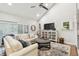Inviting living room featuring vaulted ceilings, plush seating, stylish decor, and natural light at 4222 Hartwood Ln # 1202, Tampa, FL 33618