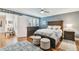 Comfortable main bedroom with wood floors, dresser, ceiling fan, and soft natural light at 4222 Hartwood Ln # 1202, Tampa, FL 33618