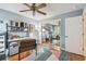 Comfortable home office features a ceiling fan, modern shelving and decor at 4222 Hartwood Ln # 1202, Tampa, FL 33618
