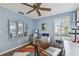 Inviting home office features blue walls, ceiling fan, daybed, and bright natural light at 4222 Hartwood Ln # 1202, Tampa, FL 33618