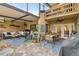 Back patio with both covered seating and dining areas, barbecue, and second-story balcony at 4222 Hartwood Ln # 1202, Tampa, FL 33618