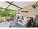 Relaxing screened patio with outdoor seating area, plants, and a view of the backyard at 4222 Hartwood Ln # 1202, Tampa, FL 33618