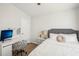 Cozy bedroom with a desk, comfortable chair, and natural light at 1010 Elm Grove Ln, Valrico, FL 33596