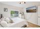 Well-lit bedroom with a large window, TV, and a relaxing atmosphere at 1010 Elm Grove Ln, Valrico, FL 33596