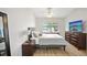 Bright bedroom featuring a large bed and natural light at 1010 Elm Grove Ln, Valrico, FL 33596