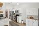 Bright kitchen with stainless steel appliances and white cabinets at 1010 Elm Grove Ln, Valrico, FL 33596