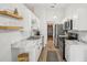 Bright kitchen with stainless steel appliances, white cabinets, and marble countertops at 1010 Elm Grove Ln, Valrico, FL 33596