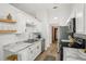 Bright kitchen with stainless steel appliances, white cabinets, and marble countertops at 1010 Elm Grove Ln, Valrico, FL 33596