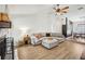 Open-concept living room with vaulted ceiling, ceiling fan and ample seating at 1010 Elm Grove Ln, Valrico, FL 33596