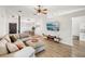 Cozy living room with a sectional sofa and open layout to the dining room at 1010 Elm Grove Ln, Valrico, FL 33596
