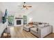 Bright and airy living room featuring a fireplace and comfortable sectional sofa at 1010 Elm Grove Ln, Valrico, FL 33596