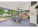 Relaxing screened-in porch with comfortable seating and peaceful lake views at 1010 Elm Grove Ln, Valrico, FL 33596
