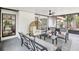 Cozy screened porch with stylish furnishings, perfect for outdoor living at 1010 Elm Grove Ln, Valrico, FL 33596
