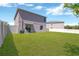 Expansive backyard featuring a well-maintained lawn and a patio area for outdoor enjoyment at 10142 Golden Wonder Ln, Riverview, FL 33578