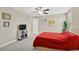 Bright bedroom with a large window, neutral colored walls, and soft carpet at 10142 Golden Wonder Ln, Riverview, FL 33578