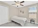 Cozy bedroom with neutral walls, soft carpet, and a window with blinds at 10142 Golden Wonder Ln, Riverview, FL 33578