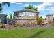 Stone sign for The Summit at Fern Hill, a beautiful community, with manicured landscaping in front of it at 10142 Golden Wonder Ln, Riverview, FL 33578