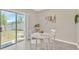Cozy dining area with sliding door access to the backyard, perfect for enjoying meals and outdoor views at 10142 Golden Wonder Ln, Riverview, FL 33578
