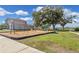 Community playground with swings and slide, set amongst the lush greenery, inviting outdoor fun at 10142 Golden Wonder Ln, Riverview, FL 33578