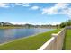 Beautiful water view of the pond behind the property on a clear, sunny day at 10142 Golden Wonder Ln, Riverview, FL 33578