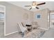 Cozy sitting area with a large rug, comfortable chairs, and a small table at 10142 Golden Wonder Ln, Riverview, FL 33578