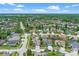 Beautiful aerial view of a neighborhood featuring mature trees and lush landscaping at 10502 Brentford Dr, Tampa, FL 33626