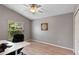 Bedroom showcasing a large window and wood laminate flooring, creating a bright and comfortable space at 10502 Brentford Dr, Tampa, FL 33626