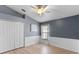 Bedroom featuring neutral walls, closet, and a window for natural light at 10502 Brentford Dr, Tampa, FL 33626