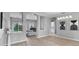 Open concept dining room with modern lighting, flowing into the living area, great for entertaining at 10502 Brentford Dr, Tampa, FL 33626