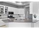 Bright, renovated kitchen with sleek countertops, stainless appliances, and ample storage at 10502 Brentford Dr, Tampa, FL 33626