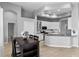 Open-concept kitchen with stainless appliances, granite countertops and adjacent dining area at 10502 Brentford Dr, Tampa, FL 33626