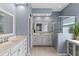 Beautiful main bathroom with double sinks, a glass-enclosed shower, and stylish fixtures at 10502 Brentford Dr, Tampa, FL 33626