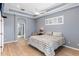 Comfortable main bedroom featuring tray ceiling, and ensuite bath and walk-in closet at 10502 Brentford Dr, Tampa, FL 33626